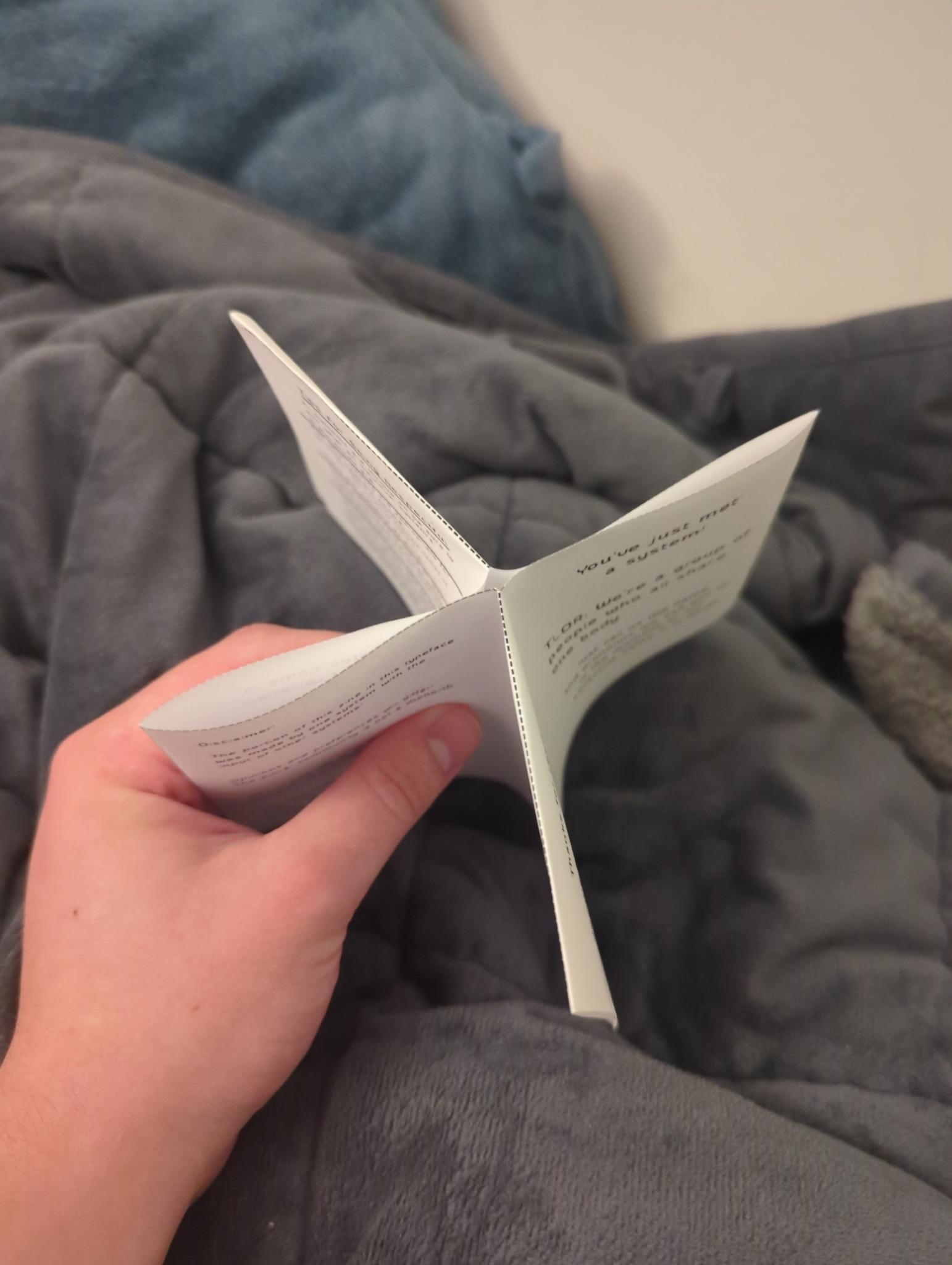 paper folded into an x shape
